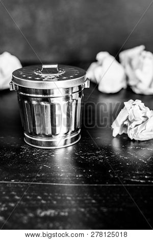 Garbage Bin On Desk Setting And Scrunched Paper Balls Around It, Concept Of Drafting And Struggling 