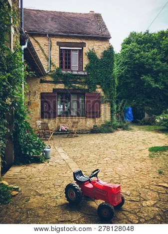 July 19, 2017. Village Ameugny France Burgundy Region In Summer. Old Stone Facade Of The Apartment B