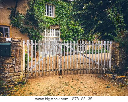 July 19, 2017. Village Ameugny France Burgundy Region In Summer. Old Stone Facade Of The Apartment B