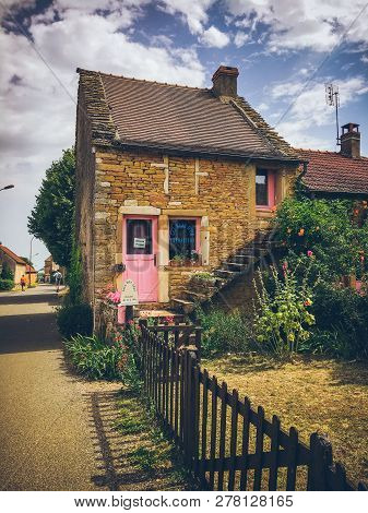 July 19, 2017. Village Ameugny France Burgundy Region In Summer. Old Stone Facade Of The Apartment B