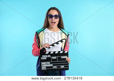 Emotional Woman With 3d Glasses And Clapperboard On Color Background. Cinema Show