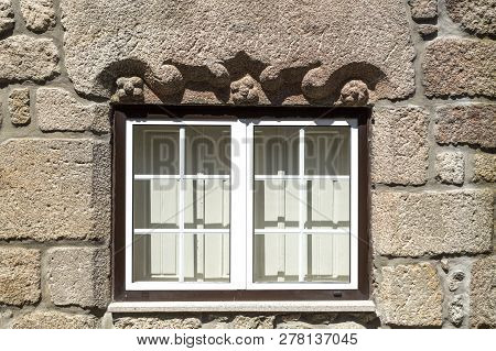 View Of A Decorative Architave Or Epistyle On Top Of A Window On An Old Building In Celorico Da Beir