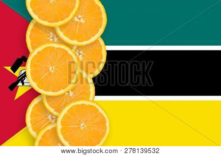 Mozambique Flag And Citrus Fruit Slices Vertical Row