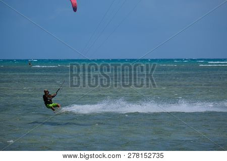 Mui Ne, Vietnam - 11 2018: Kitesurfing, Kiteboarding, Kite Surf. Extreme Sport Kitesurfing In Tropic