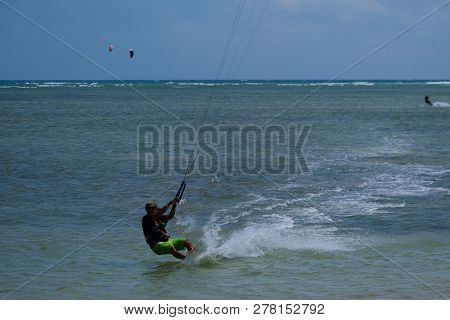 Mui Ne, Vietnam - 11 2018: Kitesurfing, Kiteboarding, Kite Surf. Extreme Sport Kitesurfing In Tropic