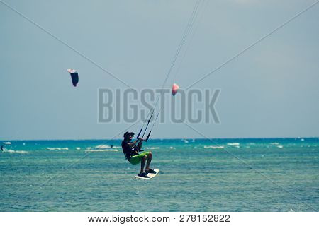 Mui Ne, Vietnam - 11 2018: Kitesurfing, Kiteboarding, Kite Surf. Extreme Sport Kitesurfing In Tropic