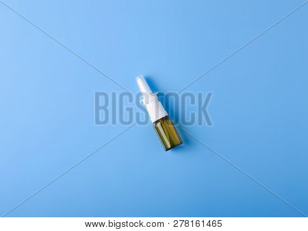 Spray For Nose Nasal On Blue Background, Top View, Medical Pharmacy Concept