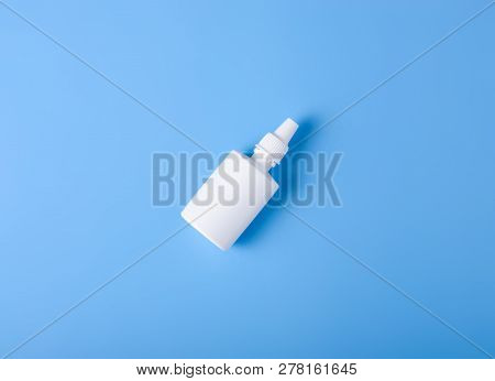 Spray For Nose Nasal On Blue Background, Top View, Medical Pharmacy Concept