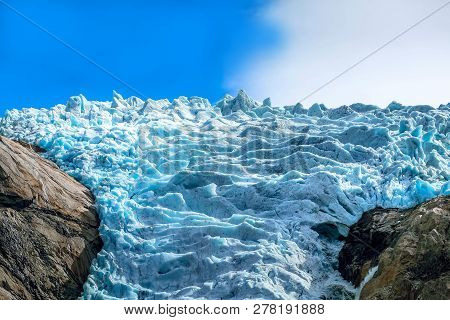 Briksdal Or Briksdalsbreen Glacier In 2018 With Melting Blue Ice, Norway Nature Landmark Close-up Vi
