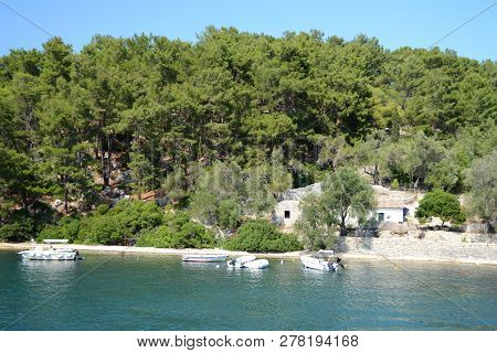 Nisida Agios Nikolaos In Front Of Paxos Island And The Canal Between Them.
