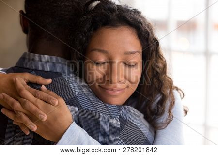 Happy African American Wife Hugging Husband Holding Tight Feelin