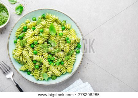 Tasty Appetizing Italian Pasta Al Bronzo With Pesto Sauce, Green Pea, Basil And Cheese Served On Pla