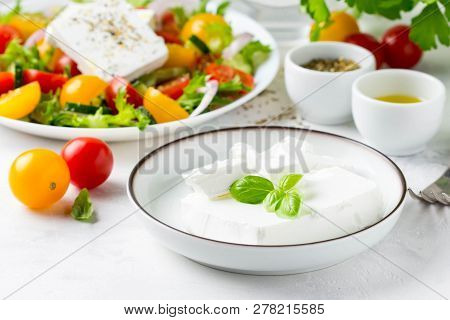 Fresh Greek Feta Cheese In A Bowl Whole And Slices For Salad With Vegetables