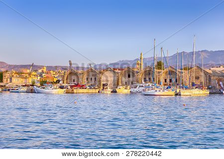 Travel Concepts. Picturesque Image Of Old Venetian Harbour Of Chania With Line Of Fisihing Boats And