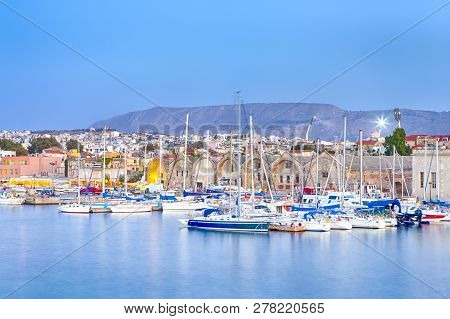 Travel Concepts. Picturesque Image Of Old Venetian Harbour Of Chania With Line Of Fisihing Boats And