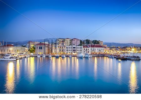 Travel Concepts. Picturesque Image Of Old Venetian Harbour Of Chania With Fisihing Boats And Yachts 