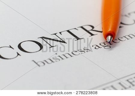 Fragment Of A Contract Printed On Paper With A Ballpoint Pen. Macrophoto Word Contract Closeup. The 