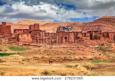 Old Berber Architecture In High Atlas Mountains Region In Morocco. Houses Of Clay At The Foot Of The