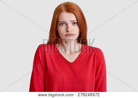 Displeased Ginger Lady Frowns Face, Has Freckled Skin, Wears Red Jumper, Doenst Like Something, Mode
