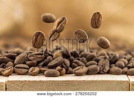 Flying Fresh Coffee Beans As A Background With Copy Space. Coffee Beans Falling Down