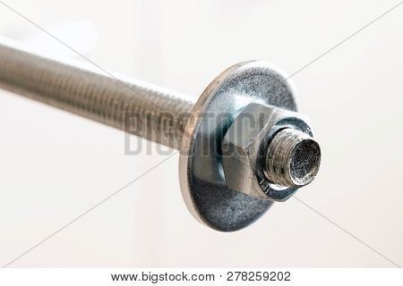 Stainless Steel Bolts And Nuts On A White Background. Bolt, Washer And Nut On A White Background. Bo