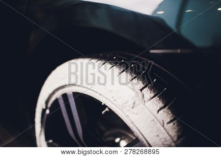 Car Care Or Car Detailing Process. Using Black Sponge To Washing The Tire. Blacker Rubber.