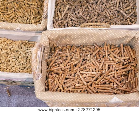 Pellets Biomass- Close Up Studio Shot. Macro Shot Of Energy Efficient Wood Pellets Fills Frame. Wood