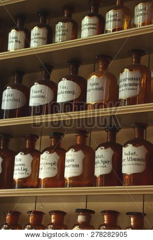 Enkhuizen, The Netherlands - October 12th 2018: Vintage Glass Bottles In A Reconstructed 19th Centur