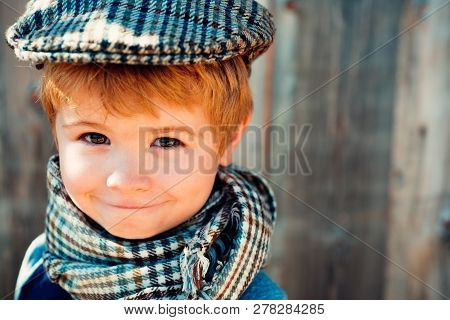Kids Fashion. The Boy In A Vintage Cap. Old School. Smiling Child. Beautiful Poster On Wooden Backgr