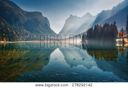 Majestic Mountains Reflected In Water In Beautiful Dobbiaco Lake At Sunny Morning In Autumn.  Fall I