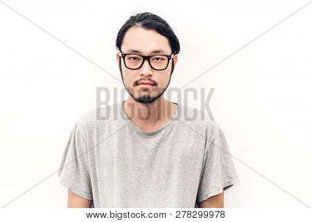 Portrait Of A Asian Young Handsome Man While Standing Isiolated On White Background