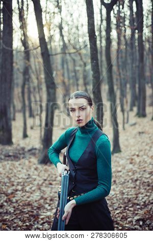 Hunter Woman. Hunter With A Backpack And A Hunting Gun. Hunting Period, Autumn Season. Female With A