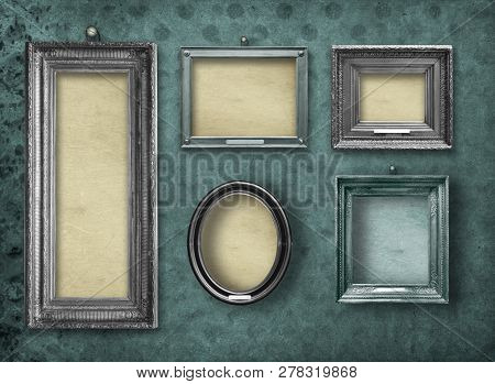 Set Of Wooden Vintage Silver  Modern,  Frames For Museum Exhibition On Old, Worn Green Wall