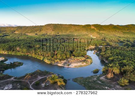 Green Nature Scenic Of Rain Forest With Curve Of River Sunrise