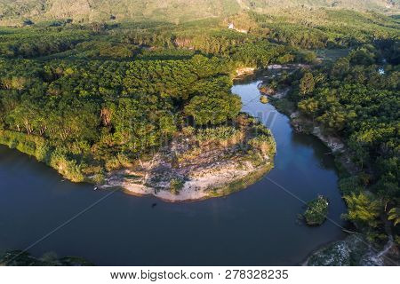 Green Nature Scenic Of Rain Forest With Curve Of River Sunrise