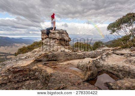 Sitting On This Rock Pillar With Excellent Views To The Valley Below Braving The Mountain Chil. Behi