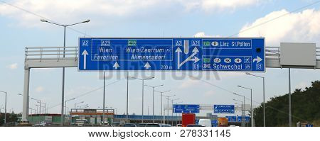 Austria Motorway  Sign With Directions To Go In The City Of Vienna Or Wien And The Written In Austri