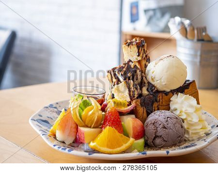 Close Up Of Sweet Dessert Mix Fruit Honey Toast With Chocolate Sauce And Ice Cream In The Restaurant