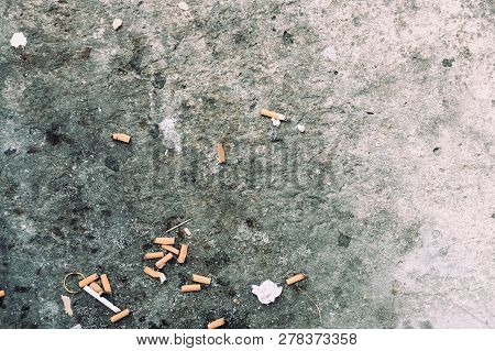 The Cigarette Butts Background. Royalty High-quality Stock Photo Image Of Dirty Cigarettes Butt On T