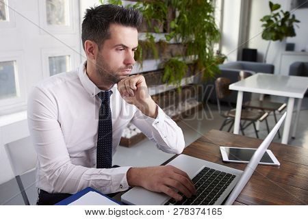 Businessman Working On Laptop In The Office