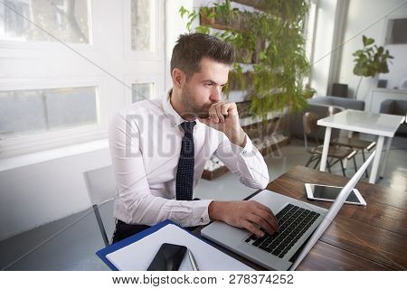 Businessman Working On Laptop In The Office
