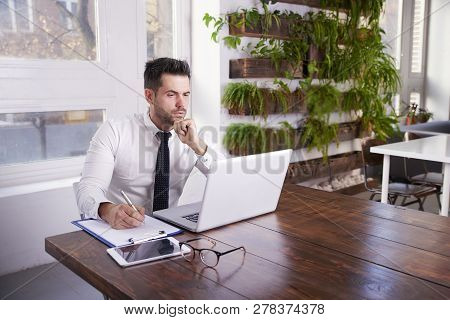 Businessman Working On Laptop In The Office