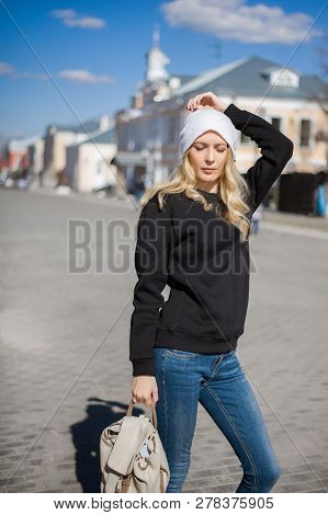 Street Fashion Look. Beautiful Girl In Black Hoody