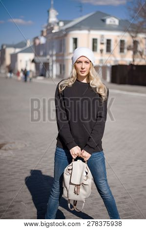 Street Fashion Look. Beautiful Girl In Black Hoody