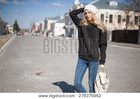 Street Fashion Look. Beautiful Girl In Black Hoody