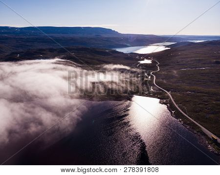Aerial View. Road Crossing Hardangervidda Mountain Plateau, Clouds Over Lakes, Morning Time. Norway 