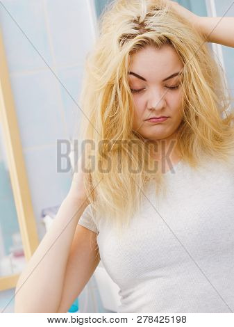 Woman Feeling Tired In Bathroom
