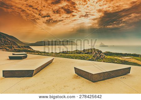Kleivodden Rest Stop Area Viewpoint With Stone Seating Bench. Arctic Ocean View With Clouds Sky. Att