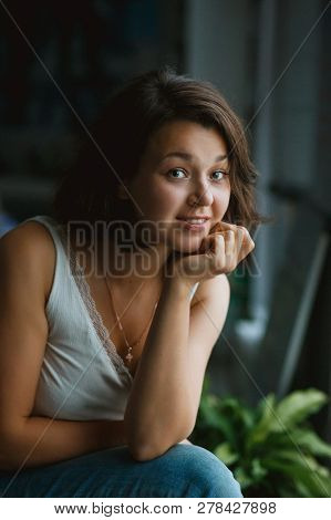 Young Pretty Woman Freelancer Looking To Camera