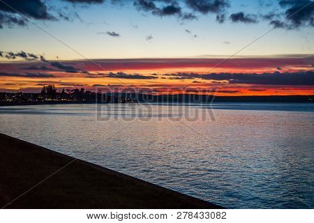 The Sky Is Rich With Colors As The Sun Set At Alki Beach In West Seattle, Washington.